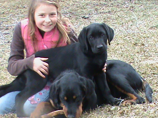 My daughter posing with puppies